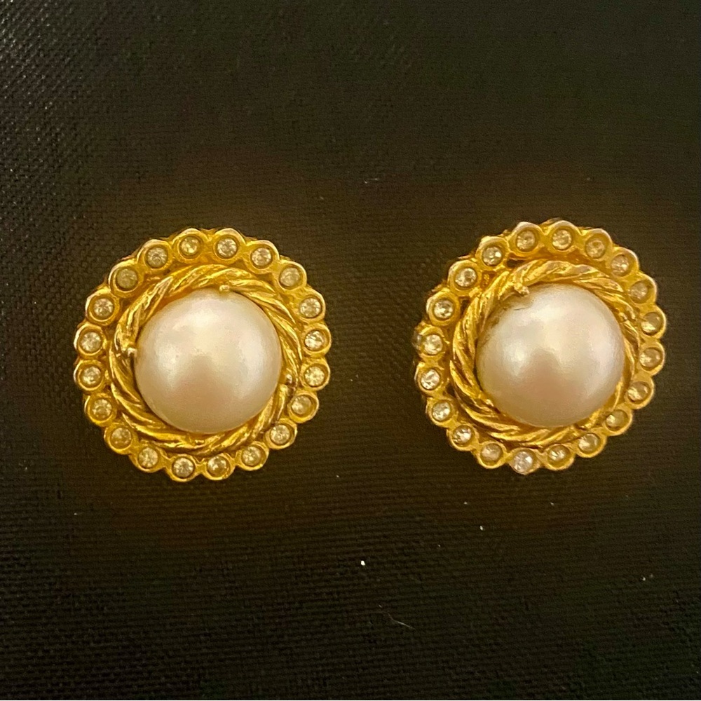 Gold toned faux pearl pierced earrings with rhinestones.